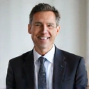 Professional portrait of John Doe, CEO